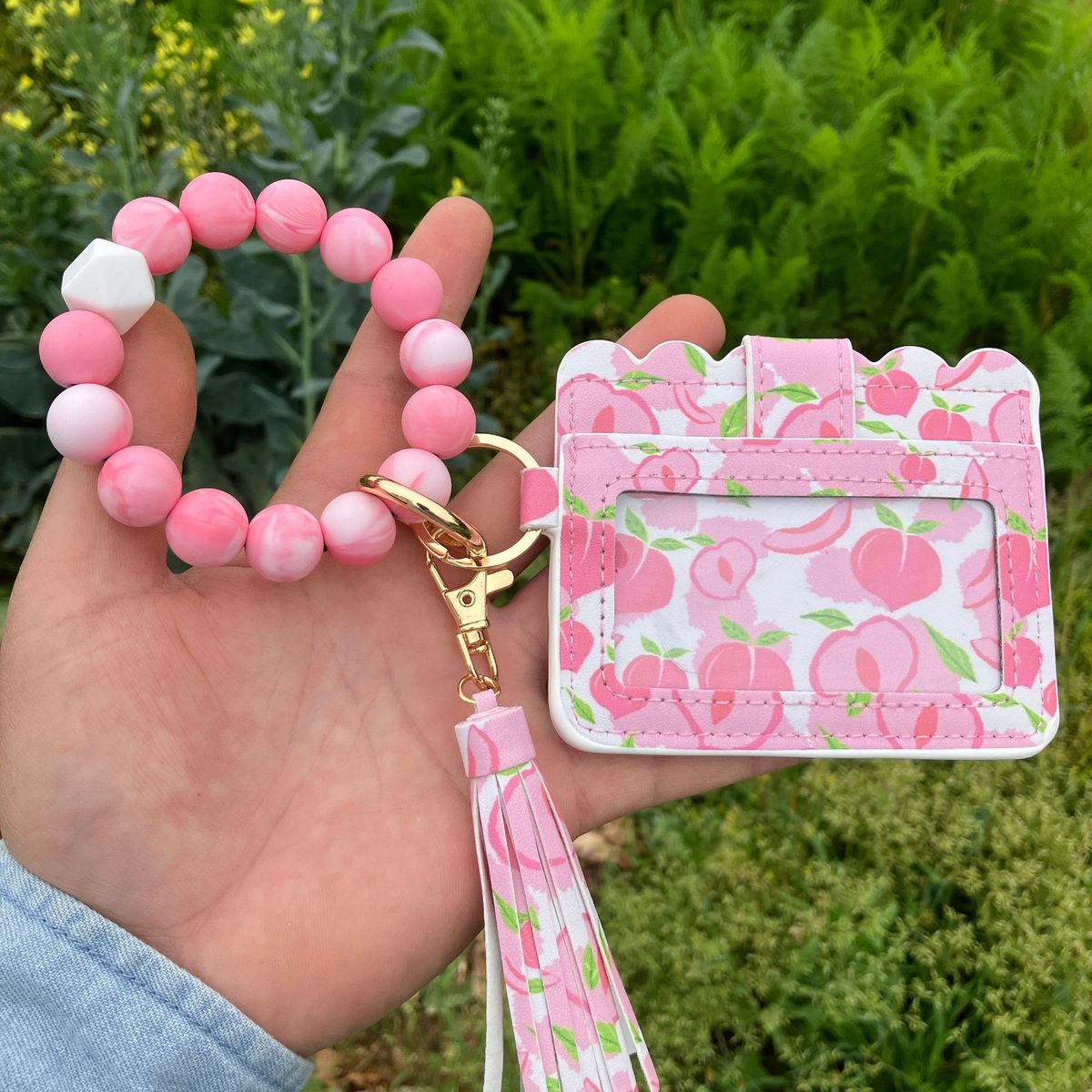 Cartera con pulsera y borlas de silicona estampadas a la moda