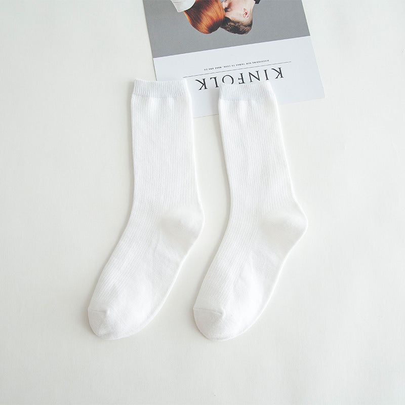 Calcetines de tubo de color liso sencillos a la moda para mujer