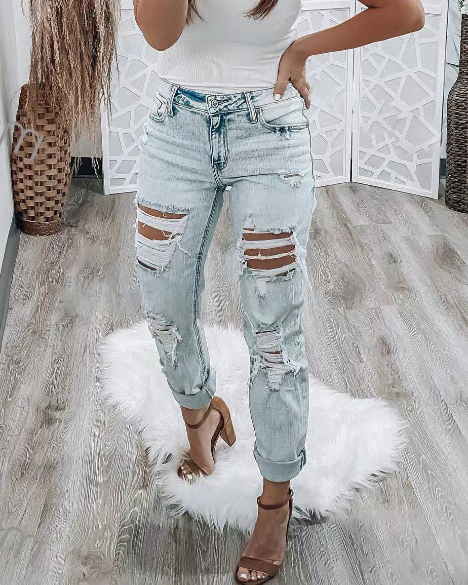 Vaqueros rotos ajustados de moda para mujer