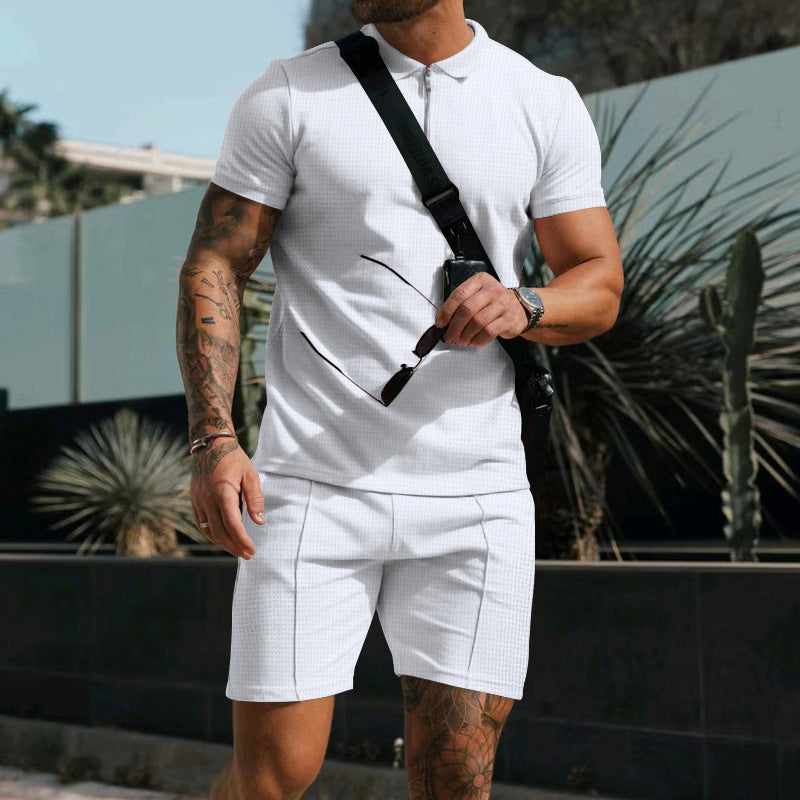 Conjunto de dos piezas de camiseta de manga corta con solapa y cremallera de color liso informal para hombre y pantalones cortos holgados
