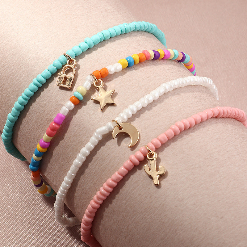 Conjunto de tobillera con cuentas multicolores bohemias y estrella creciente