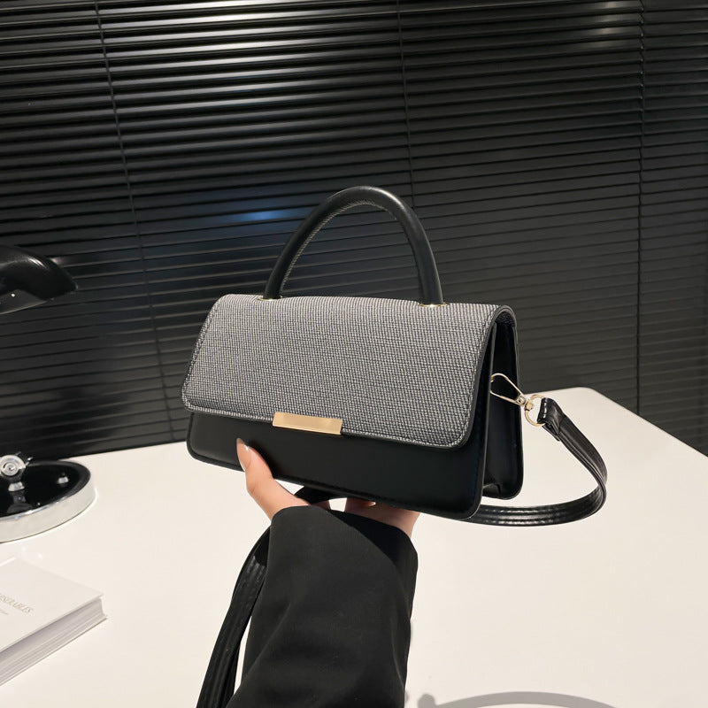 Bolso de mano con costuras abatibles de moda - Tendencia urbana