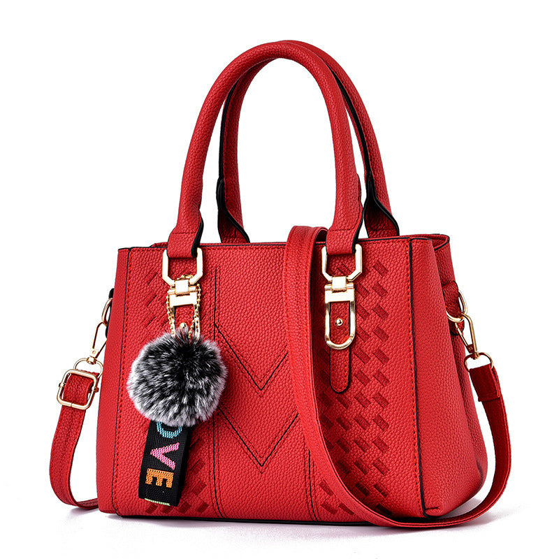Bolso de mano informal con bola de pelo de color liso para mujer
