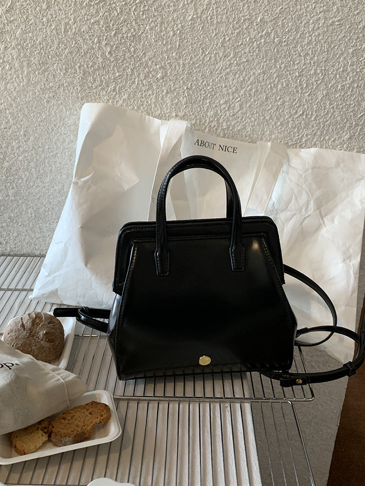Bolso de mano retro informal de piel encerada negra para mujer