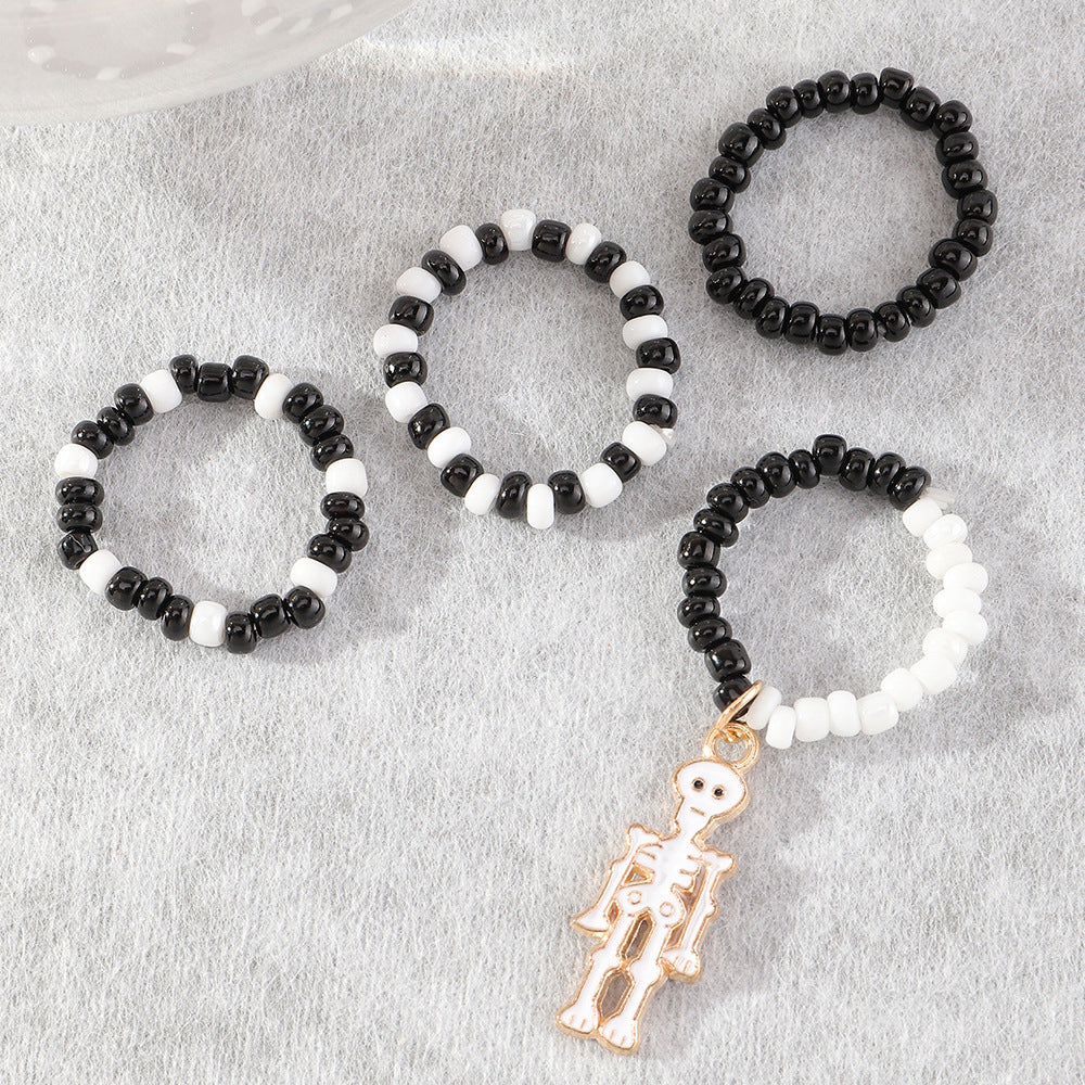 Anillos midi de calavera con cuentas blancas y negras para Halloween para mujer