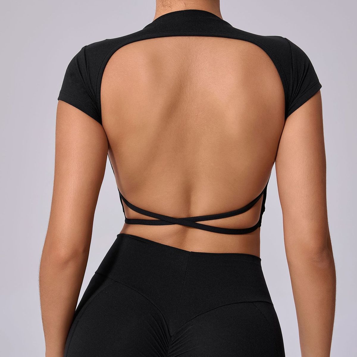 Top de yoga de manga corta de color liso sexy para mujer