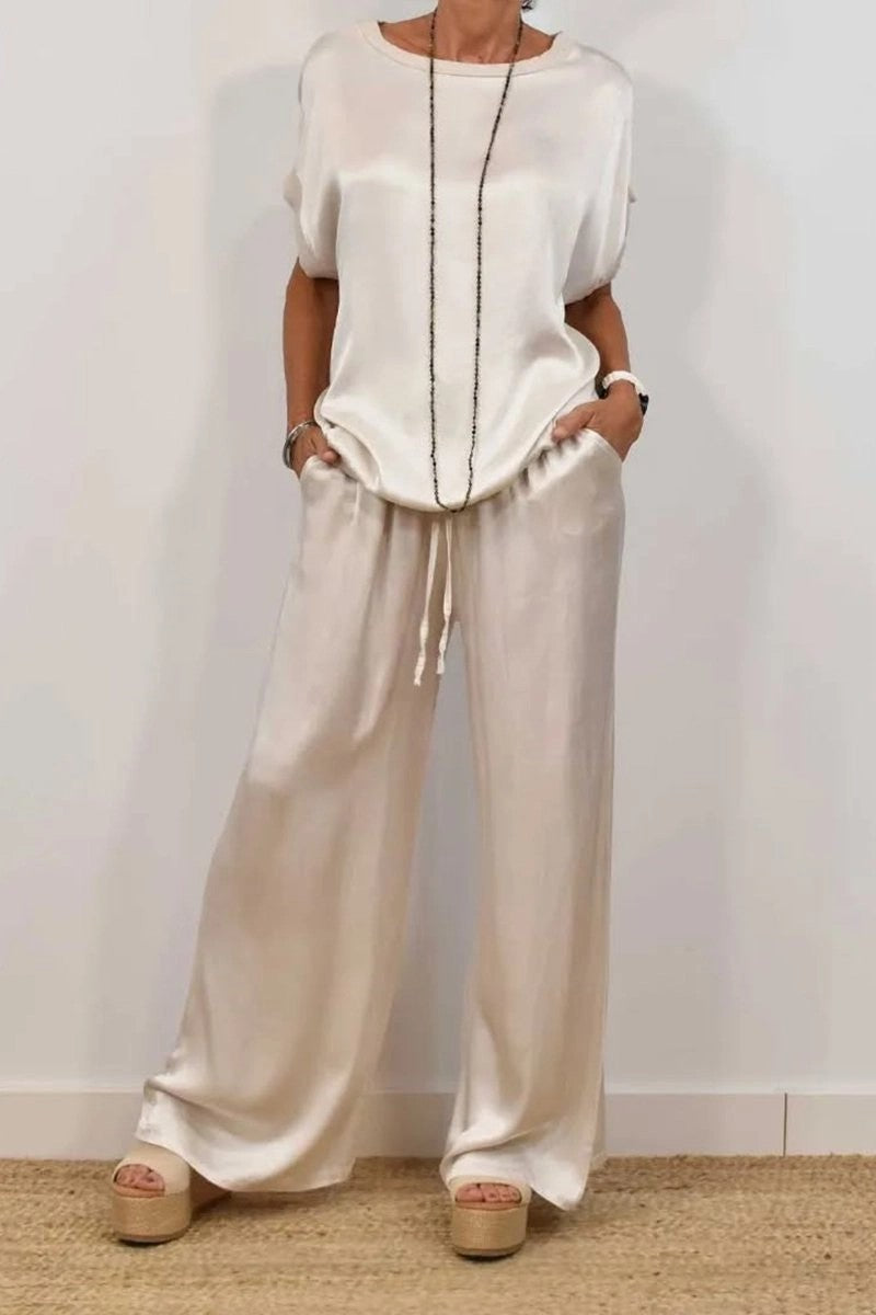 Conjunto de dos piezas de camiseta holgada de manga corta y pantalón ancho de color liso para mujer