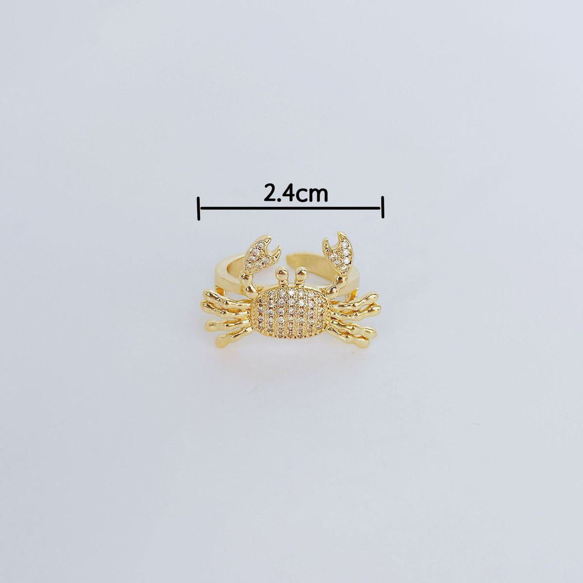 Anillo de cangrejo pequeño con circonitas bañadas en cobre para mujer