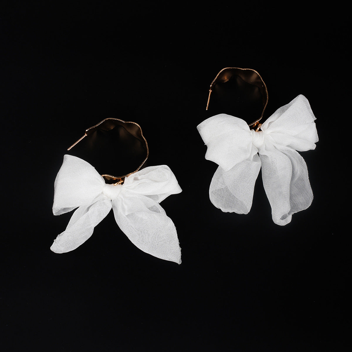 Boucles d'oreilles bohèmes en cuivre avec nœud pour les fêtes