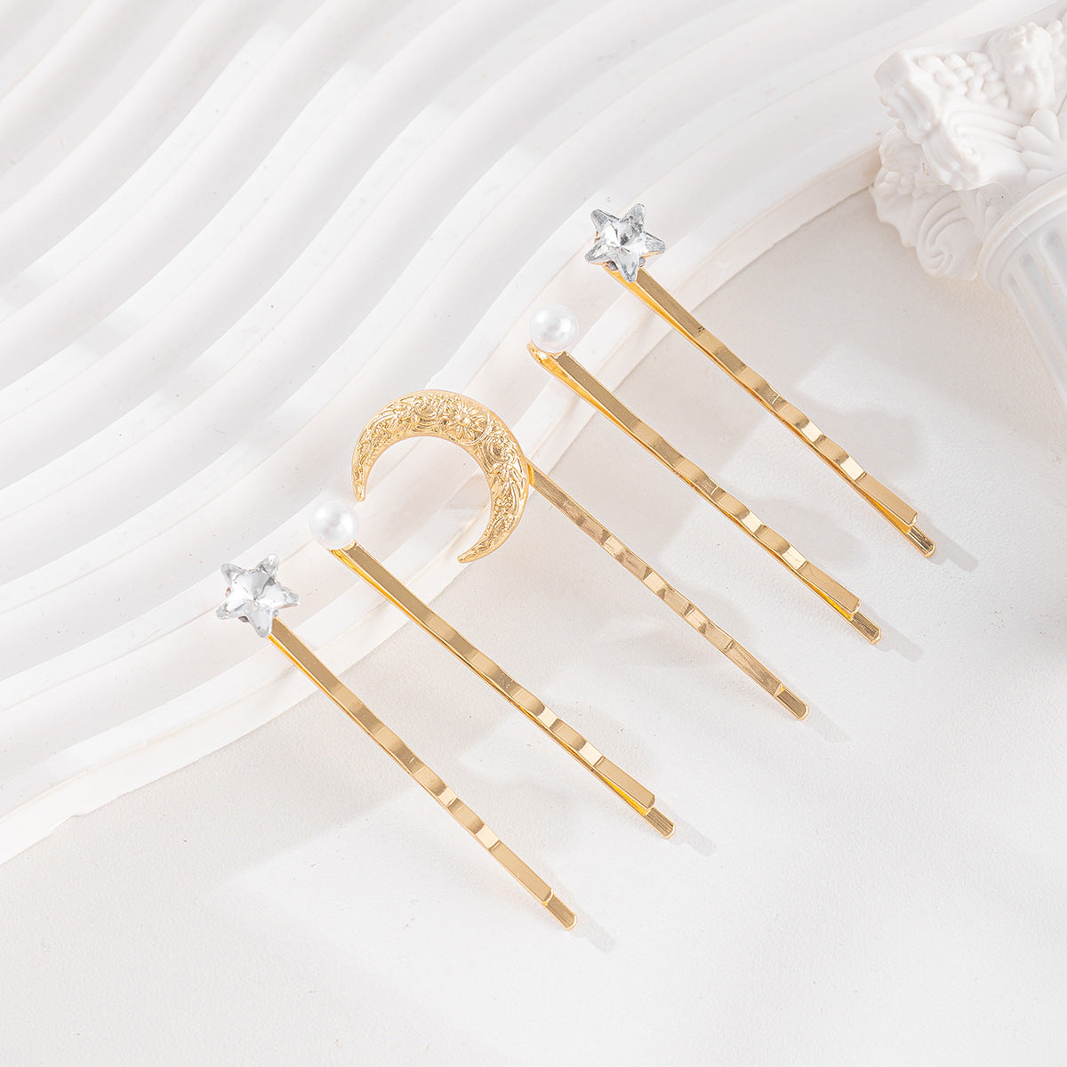 Pince à cheveux tendance en forme d'étoile avec strass et perles pour femme