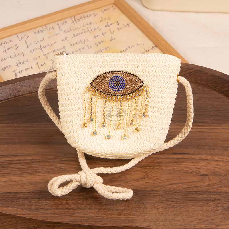 Bolso bandolera informal de paja con diseño de ojo malvado para niñas