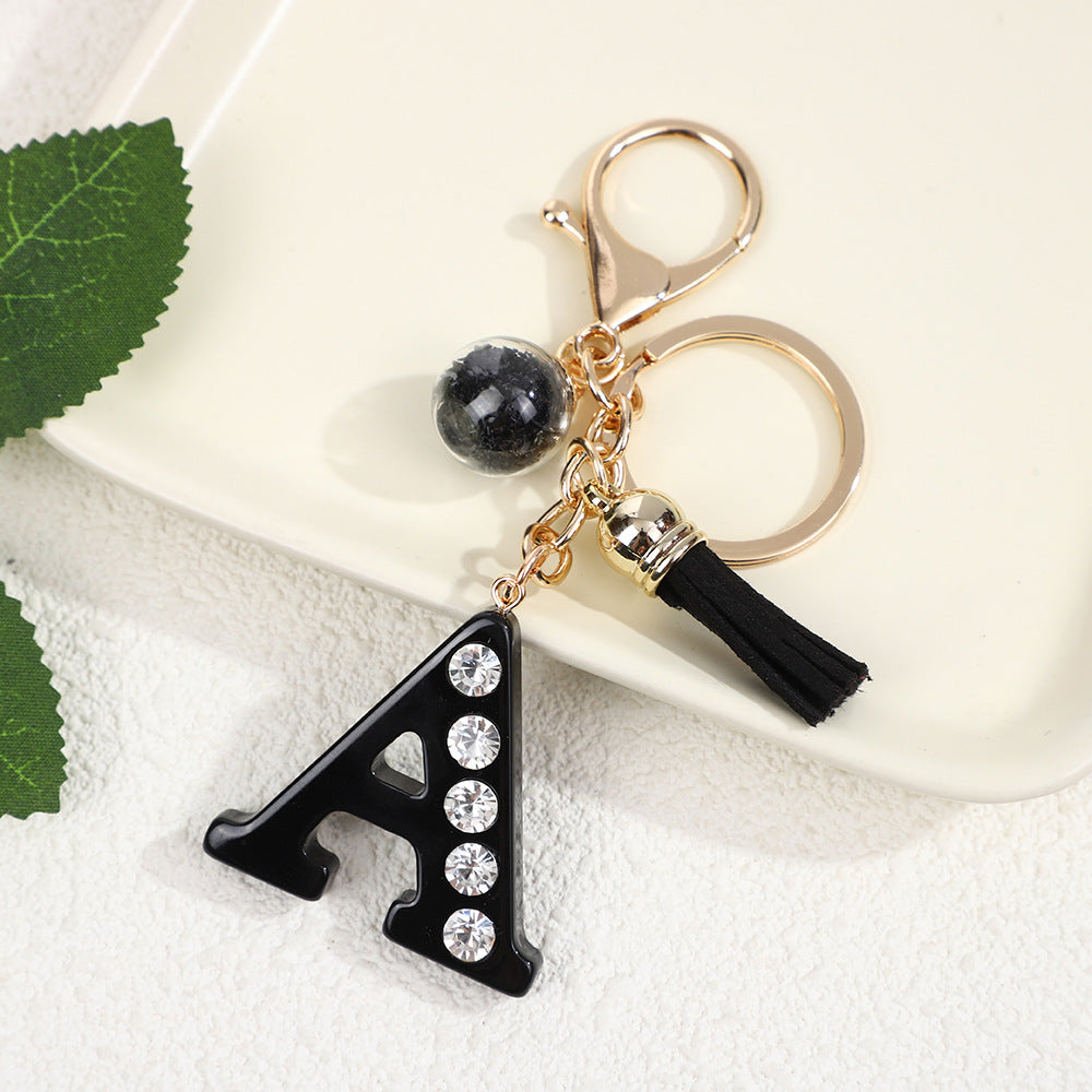 Llavero de resina negra con letras de diamantes de imitación, accesorio de arte moderno