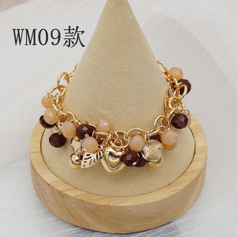 Pulsera bohemia con colgante floral en forma de corazón