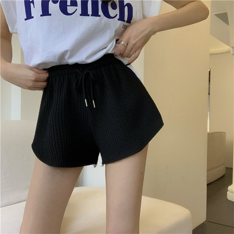 Pantalones cortos holgados de cintura alta con diseño de gofre de color liso a la moda para mujer