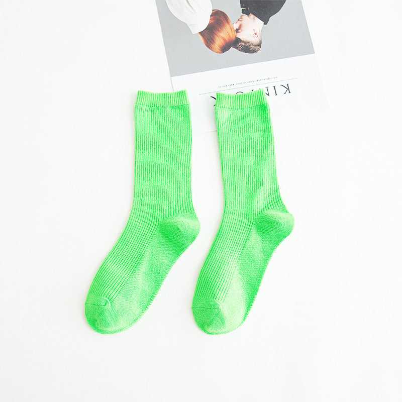 Calcetines de tubo de color liso sencillos a la moda para mujer