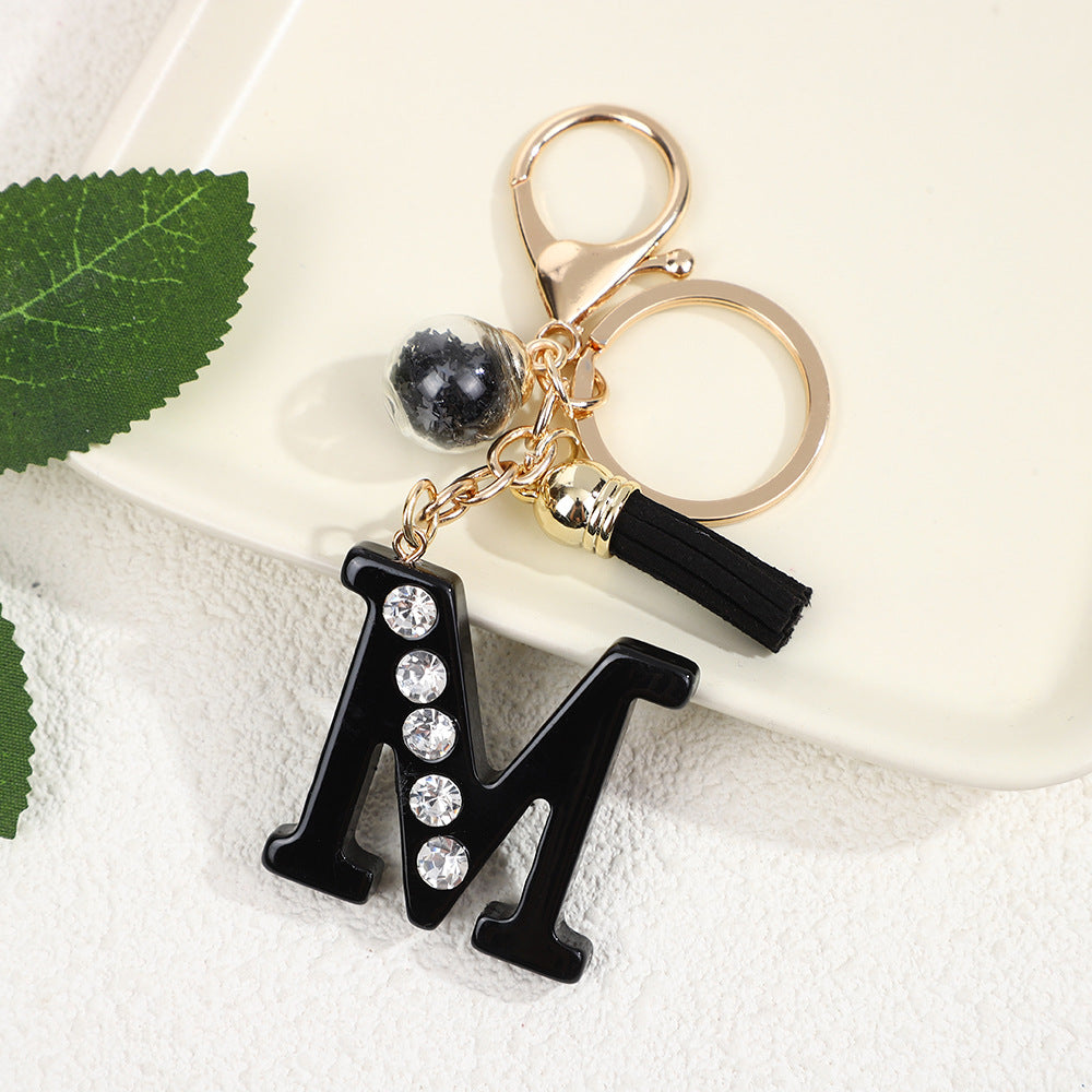 Llavero de resina negra con letras de diamantes de imitación, accesorio de arte moderno