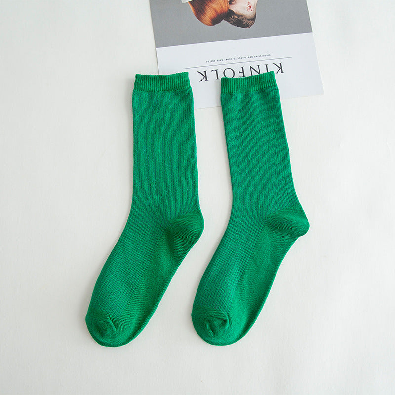 Calcetines de tubo de color liso sencillos a la moda para mujer