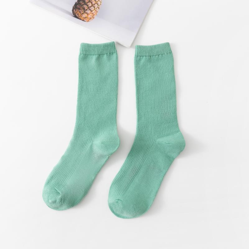 Calcetines de tubo de color liso sencillos a la moda para mujer