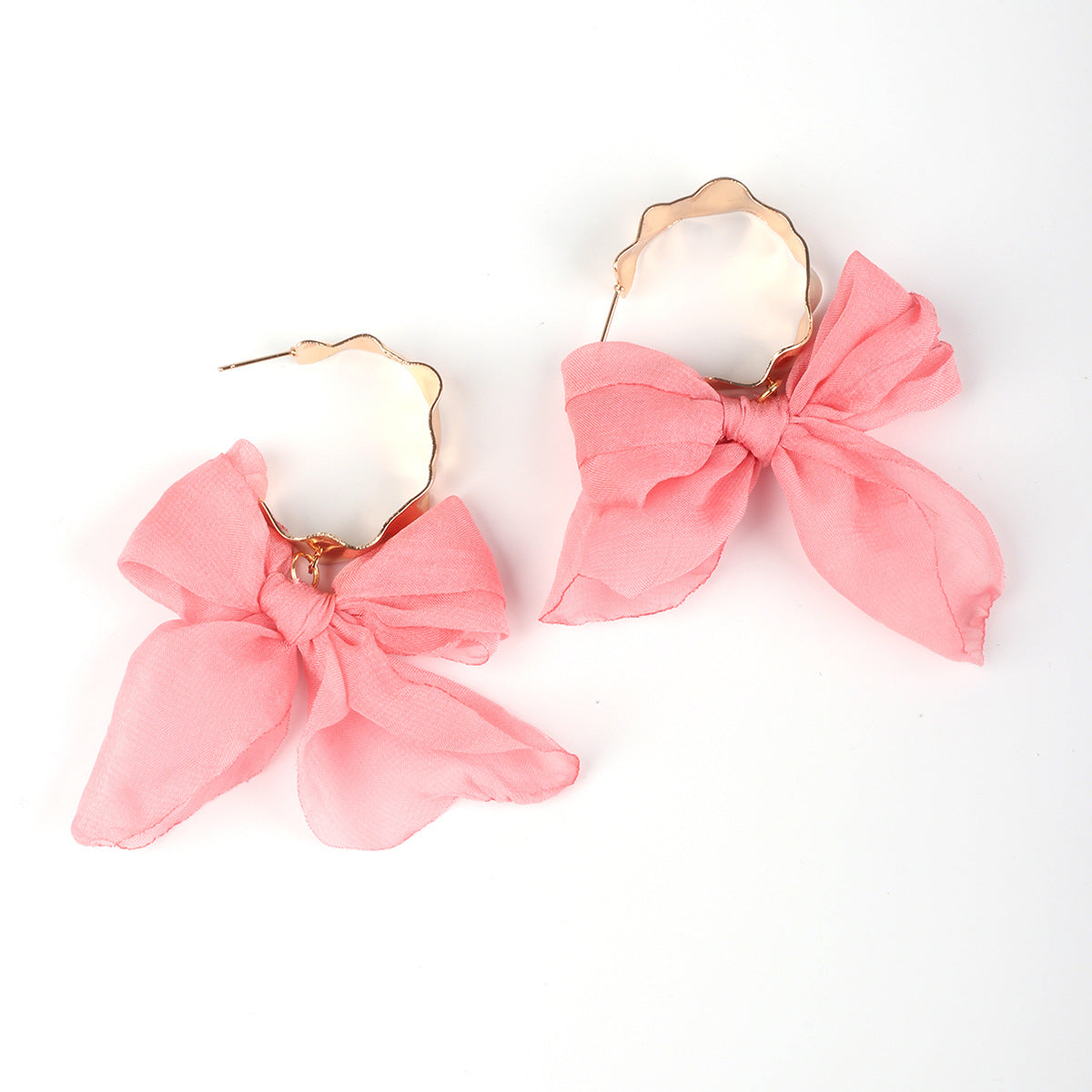 Boucles d'oreilles bohèmes en cuivre avec nœud pour les fêtes