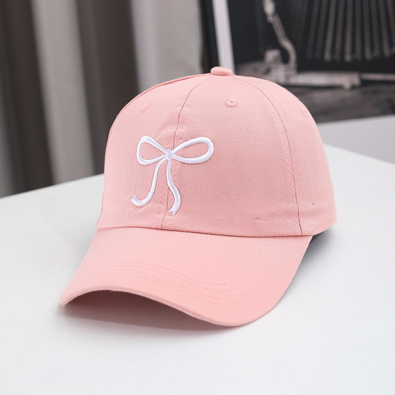 Gorra de béisbol con lazo bordado de color liso para mujer