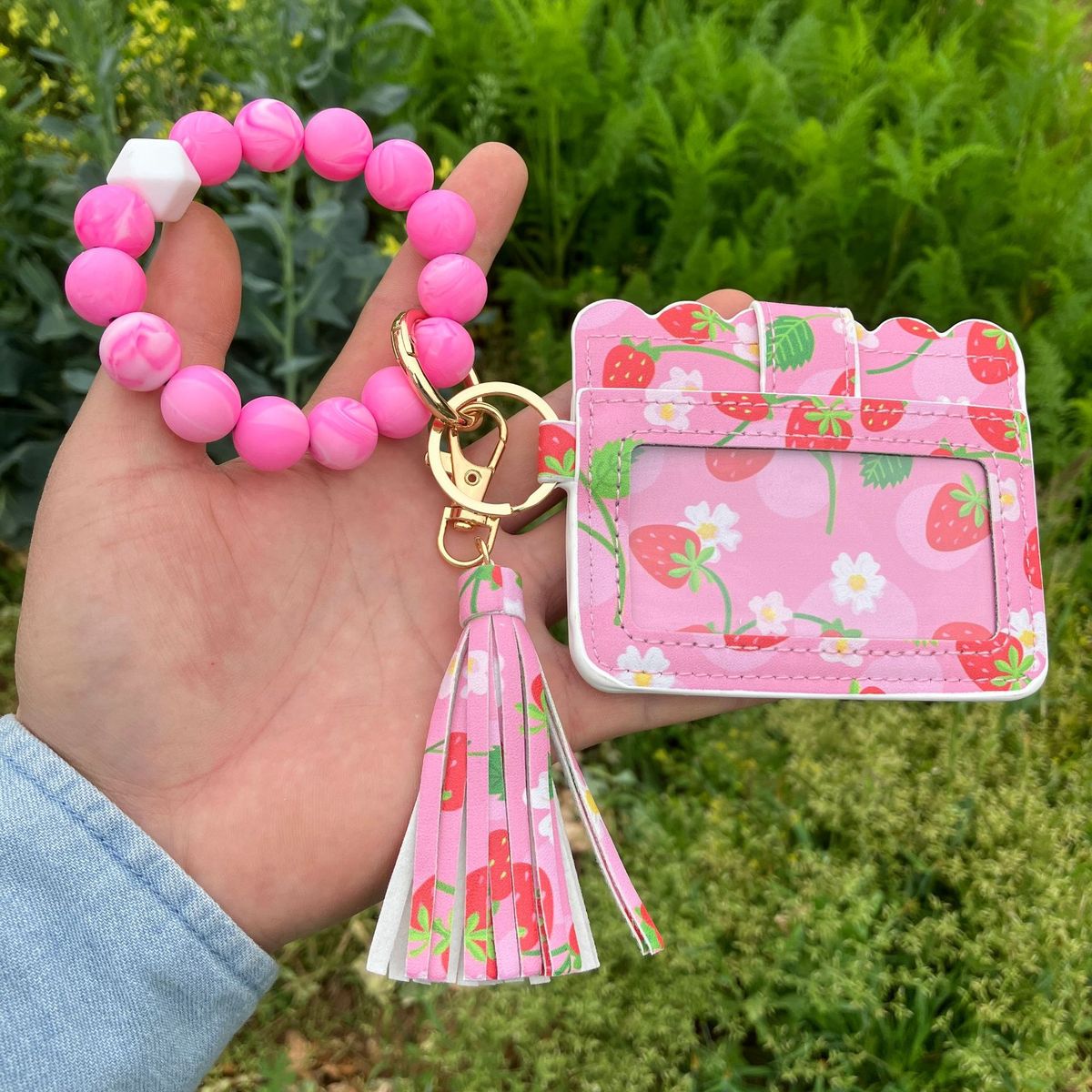 Cartera con pulsera y borlas de silicona estampadas a la moda