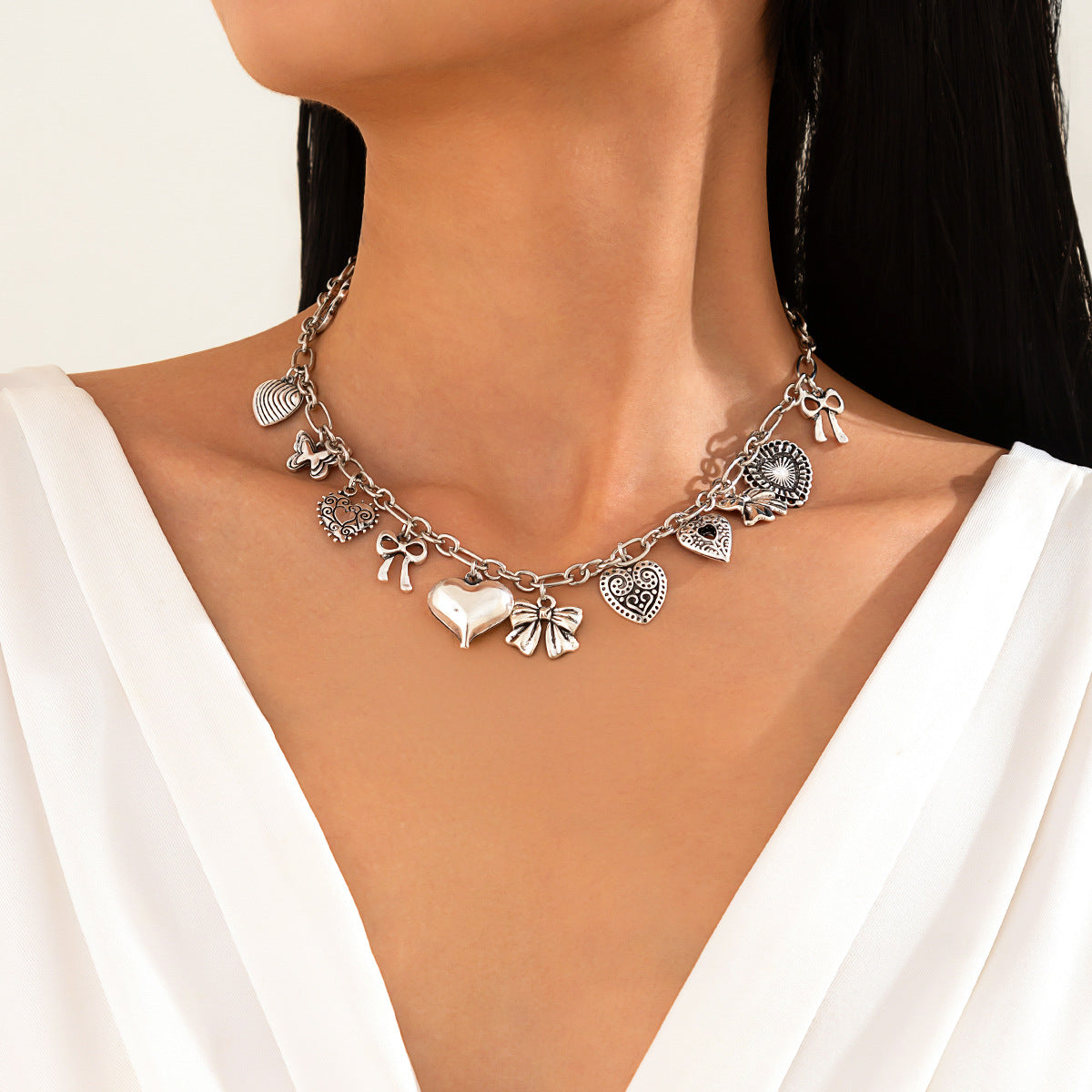 Collar de corazón con lazo de aleación para mujer