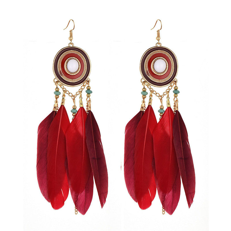 Pendientes bohemios con borlas de plumas exageradas