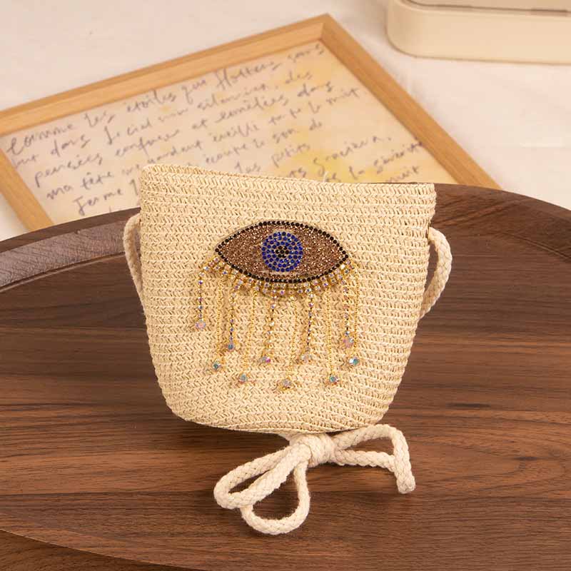 Bolso bandolera informal de paja con diseño de ojo malvado para niñas