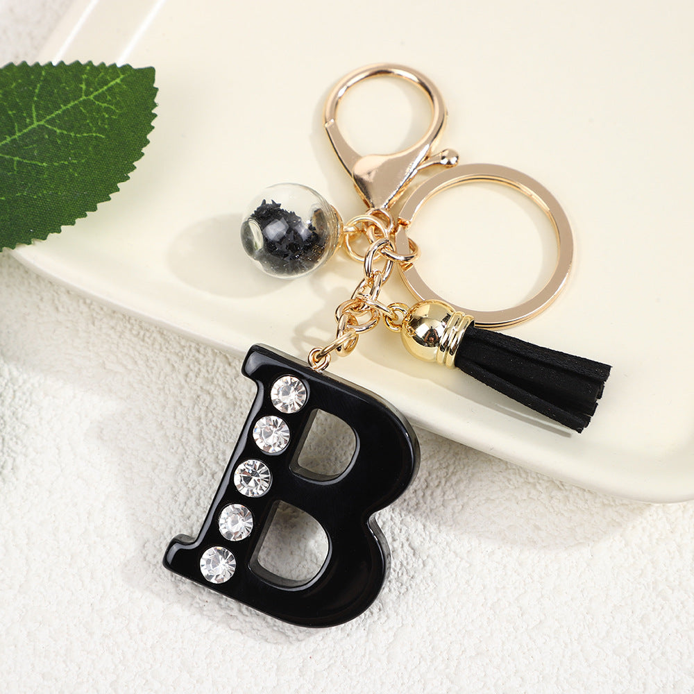 Llavero de resina negra con letras de diamantes de imitación, accesorio de arte moderno