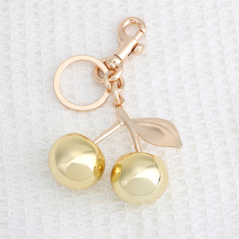 Llavero con colgante de cereza dorada para bolso de mujer, aleación de zinc, estilo frutal