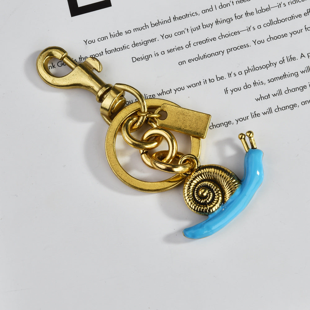 Llavero con colgante de bolso de caracol de moda, aleación orgánica marina, accesorios de moda