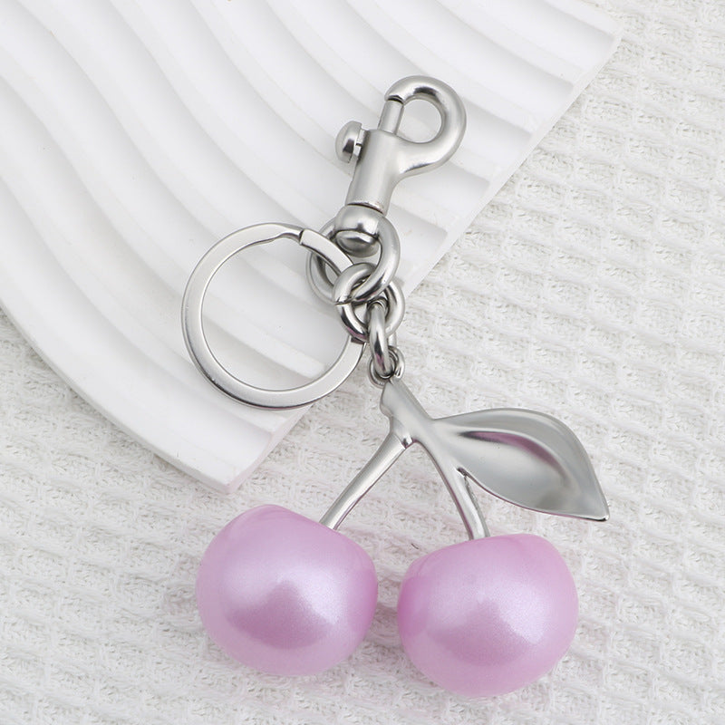 Llavero con colgante de bolso de cereza a la moda para mujer, de resina y aleación de zinc