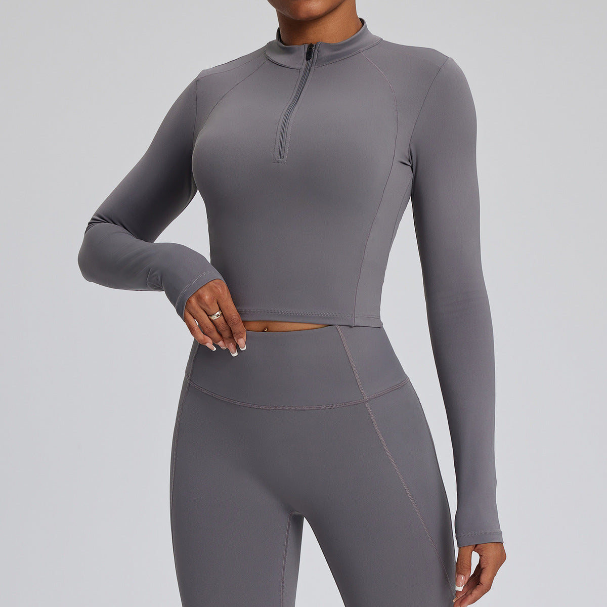 Top de yoga de manga larga de color liso para mujer, con cremallera y tejido de secado rápido