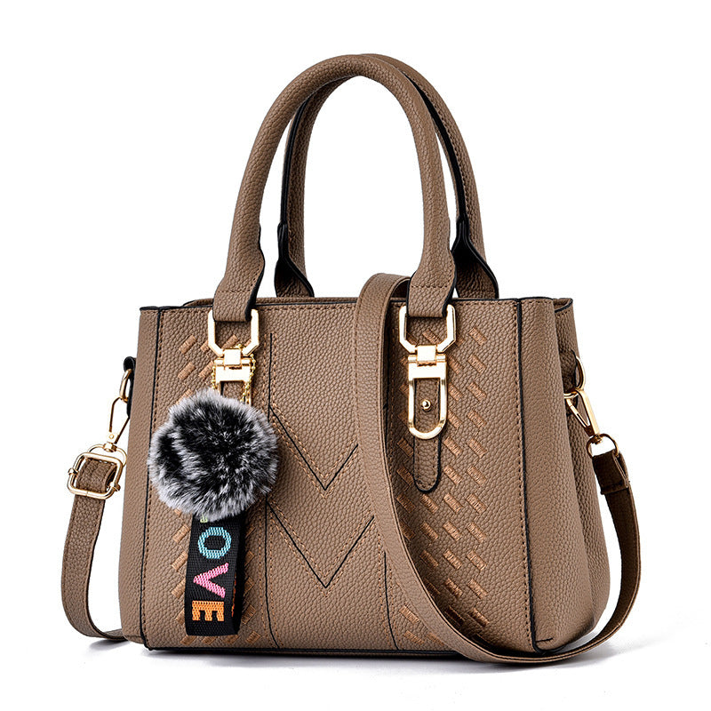 Bolso de mano informal con bola de pelo de color liso para mujer