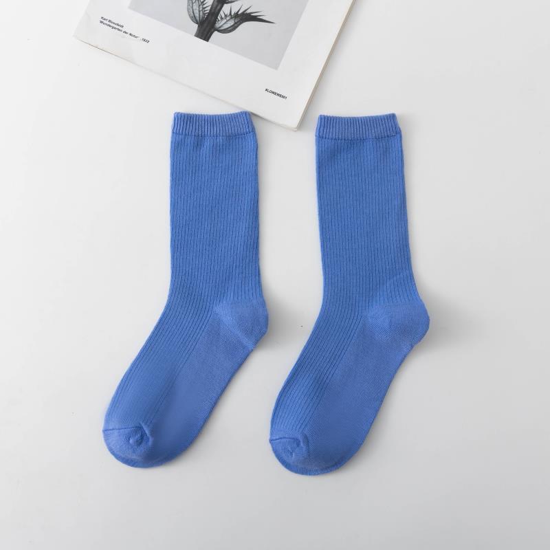 Calcetines de tubo de color liso sencillos a la moda para mujer