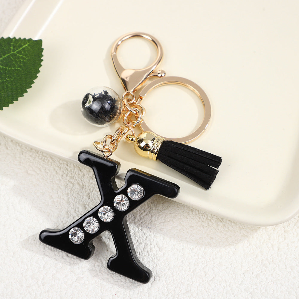 Llavero de resina negra con letras de diamantes de imitación, accesorio de arte moderno