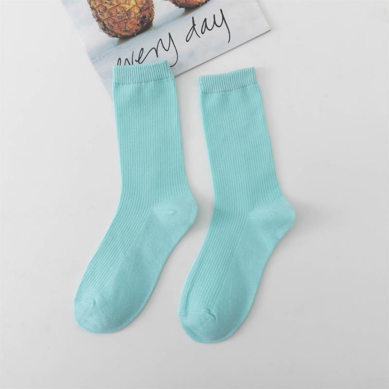 Calcetines de tubo de color liso sencillos a la moda para mujer
