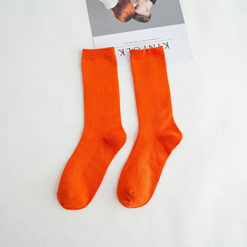 Calcetines de tubo de color liso sencillos a la moda para mujer