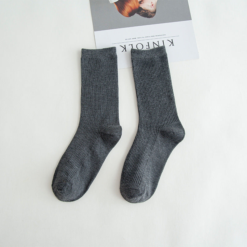 Calcetines de tubo de color liso sencillos a la moda para mujer