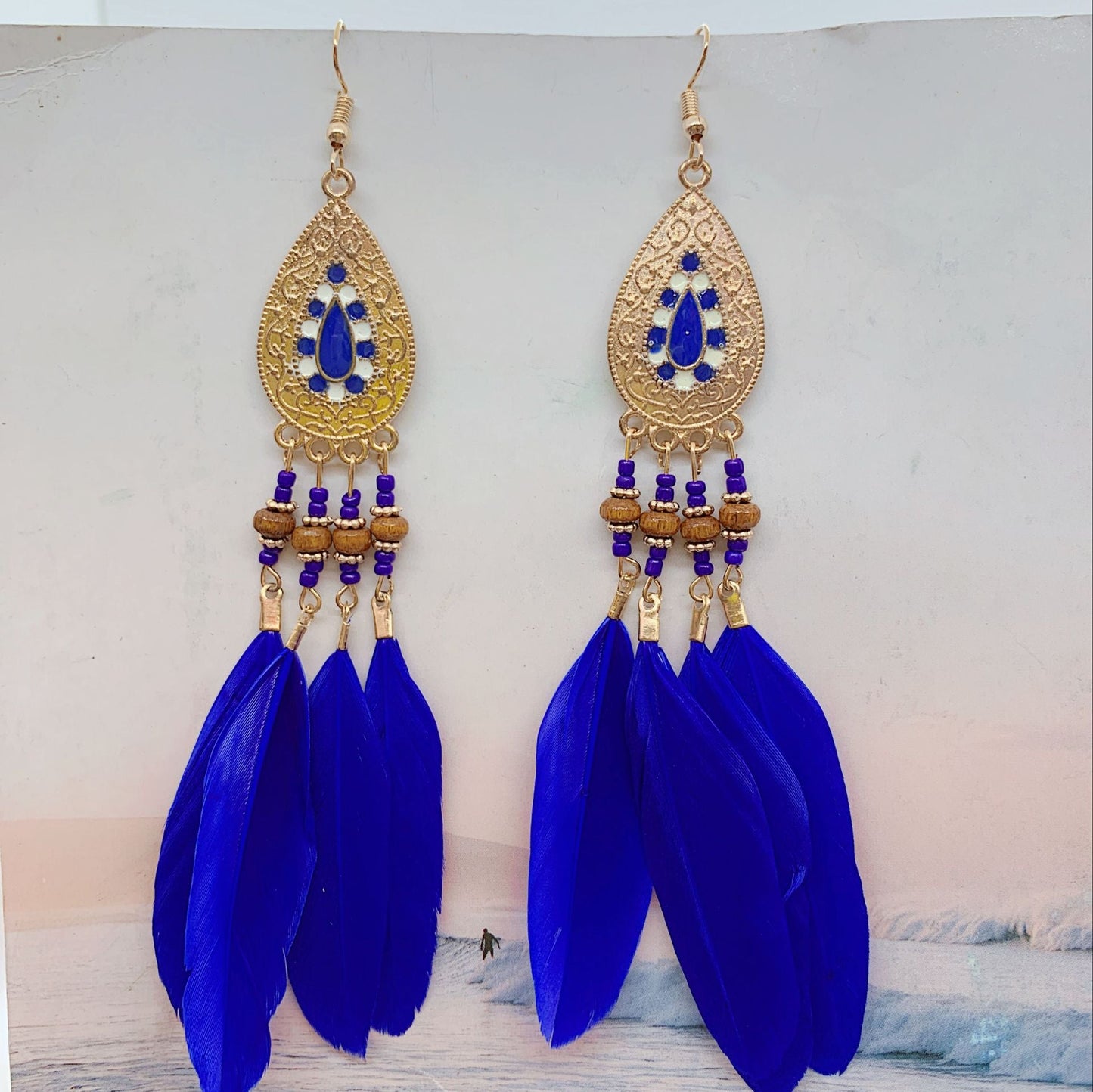 Boucles d'oreilles pendantes bohèmes vintage en perles et plumes