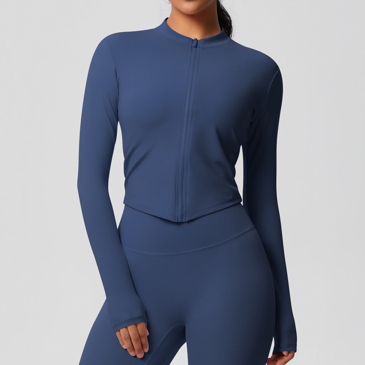 Top deportivo de manga larga de color liso a la moda para mujer