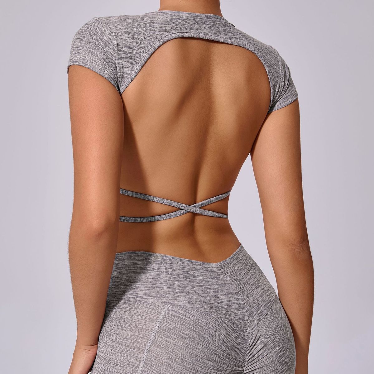 Top de yoga de manga corta de color liso sexy para mujer