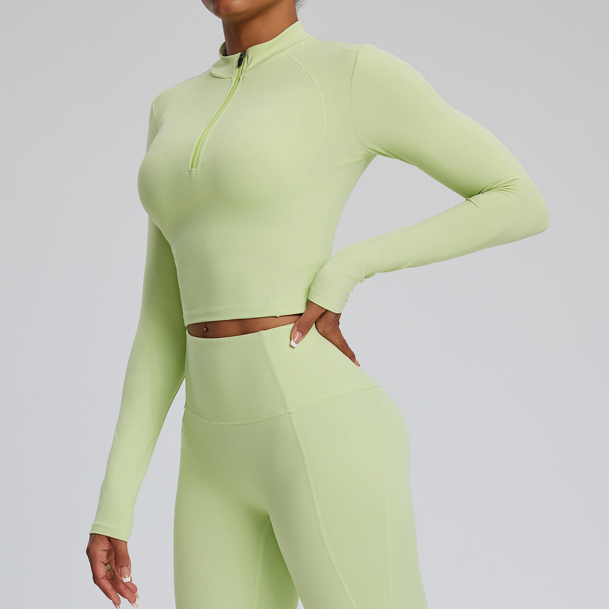 Top de yoga de manga larga de color liso para mujer, con cremallera y tejido de secado rápido