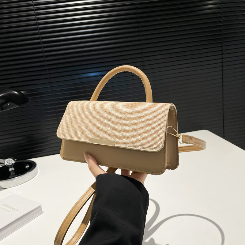 Bolso de mano con costuras abatibles de moda - Tendencia urbana