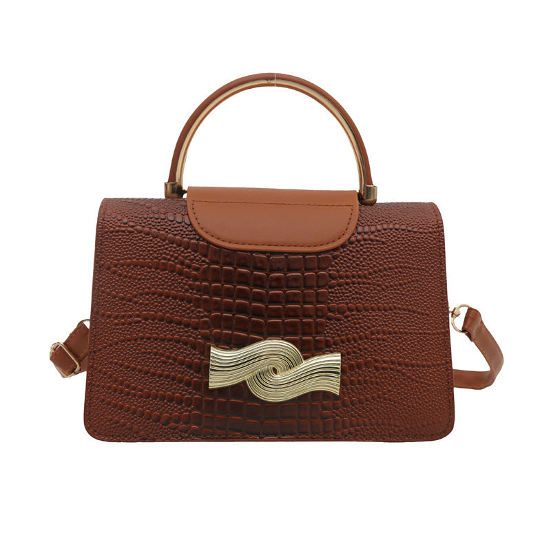 Bolso de piel de cocodrilo con hebilla de metal en color liso para mujer