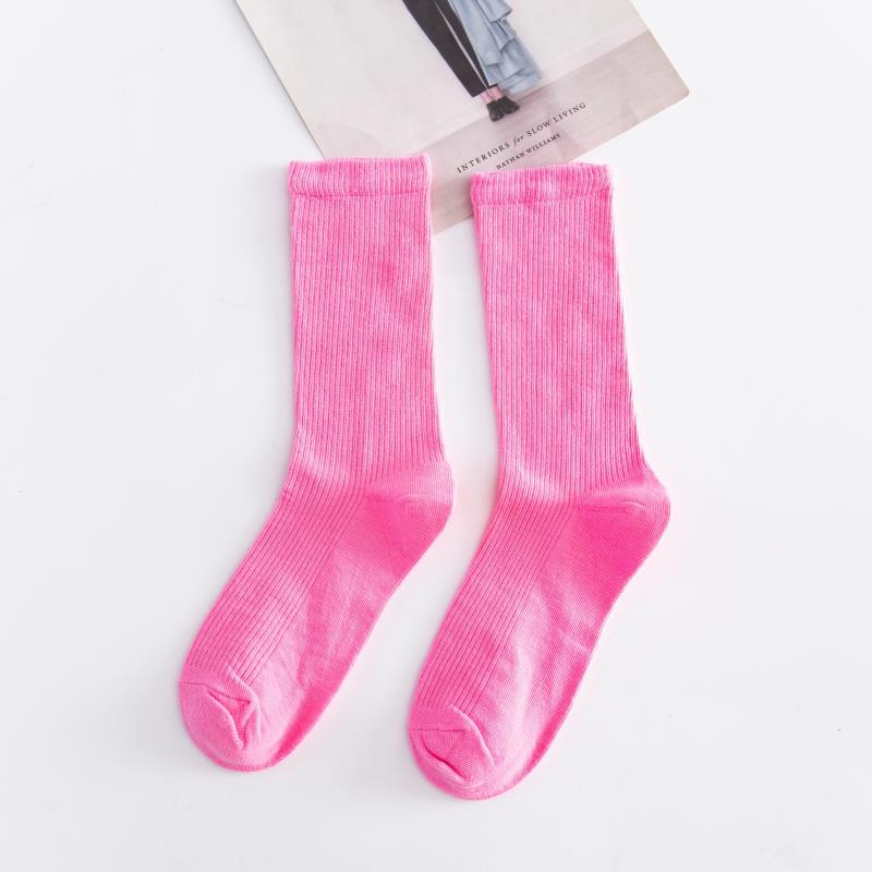 Calcetines de tubo de color liso sencillos a la moda para mujer