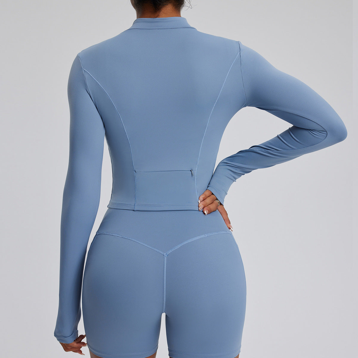 Top de yoga de manga larga de color liso para mujer, con cremallera y tejido de secado rápido