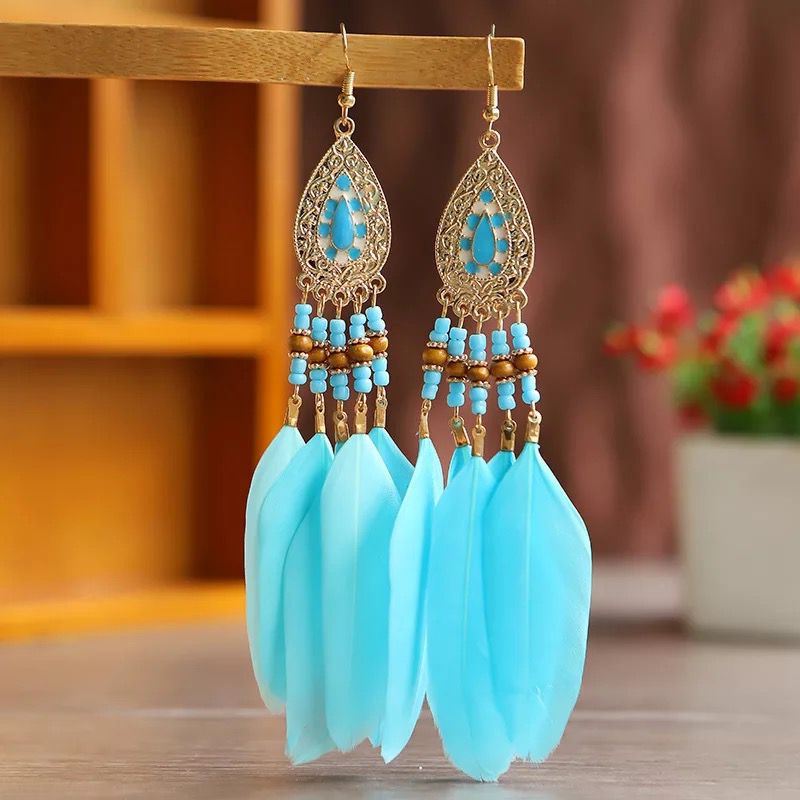 Boucles d'oreilles pendantes bohèmes vintage en perles et plumes