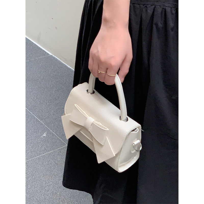 Bolso de mano pequeño cuadrado con lazo de color liso elegante para mujer