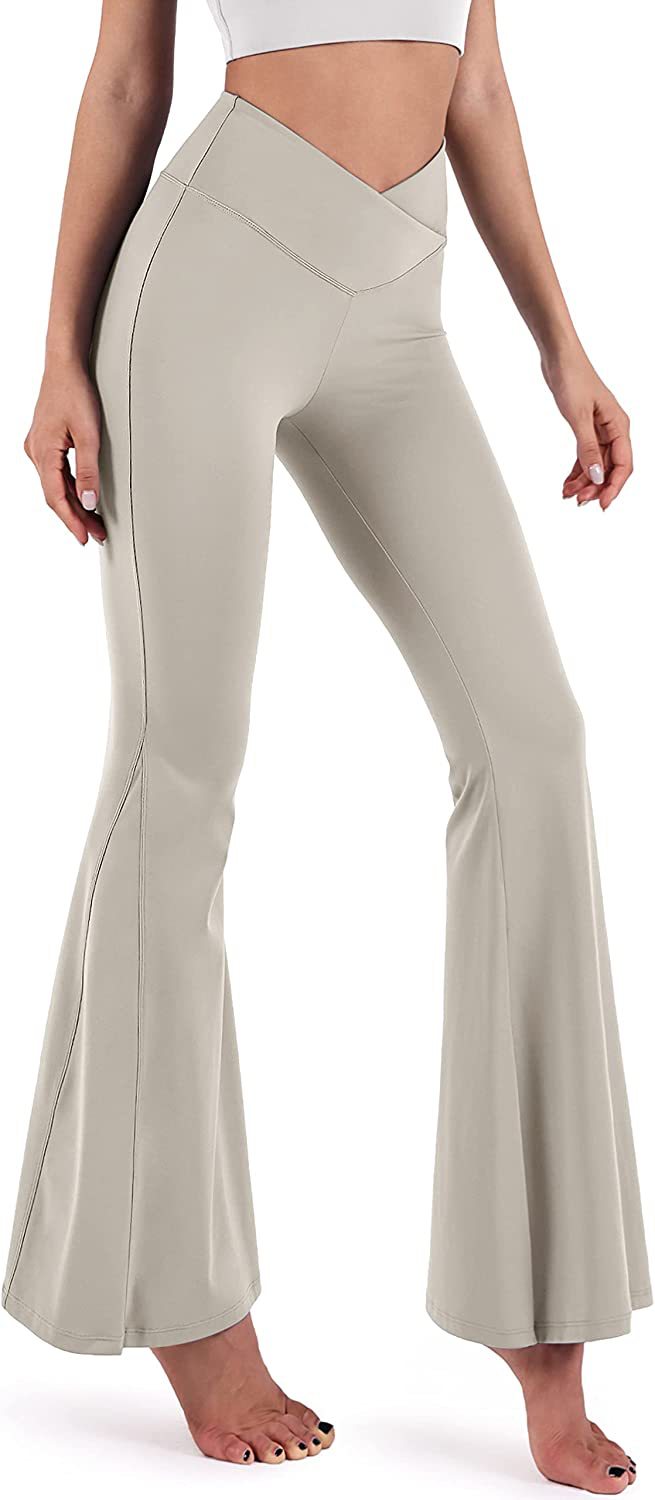 Pantalones de yoga de cintura alta con diseño cruzado de color liso a la moda para mujer